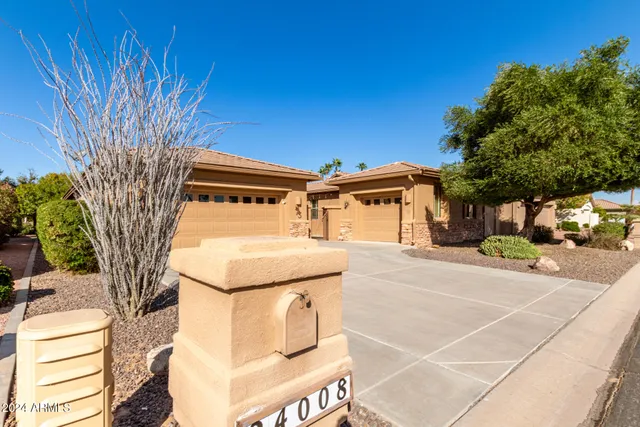 a front view of a house with a garage