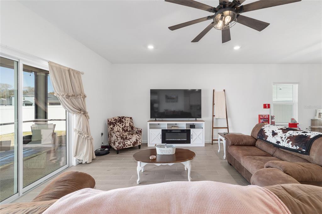 4012 Northeast 33rd Avenue Ocala, FL 34479 - Photo 19 of 77 a living room with furniture and a flat screen tv