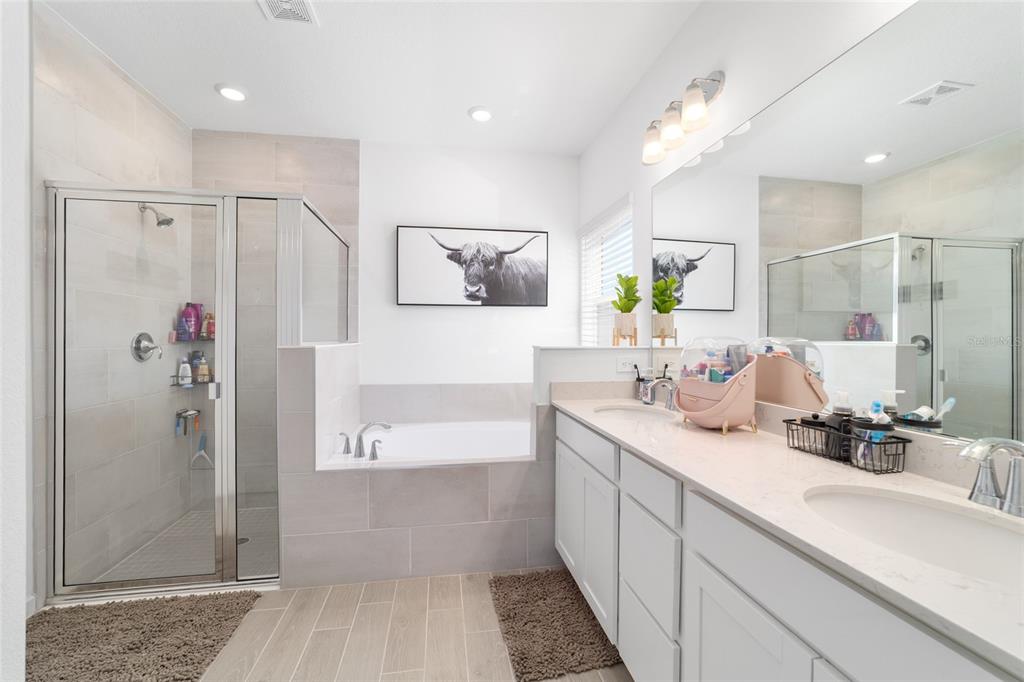4012 Northeast 33rd Avenue Ocala, FL 34479 - Photo 34 of 77 a bathroom with a double vanity sink mirror and shower