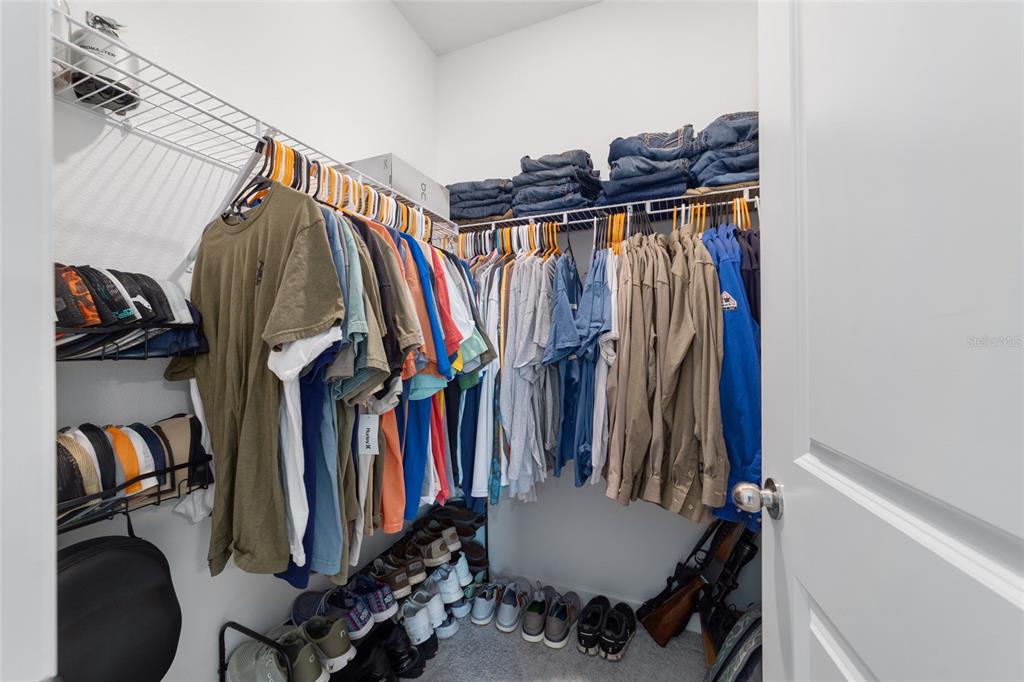 4012 Northeast 33rd Avenue Ocala, FL 34479 - Photo 38 of 77 a view of walk in closet with clothes and shoes