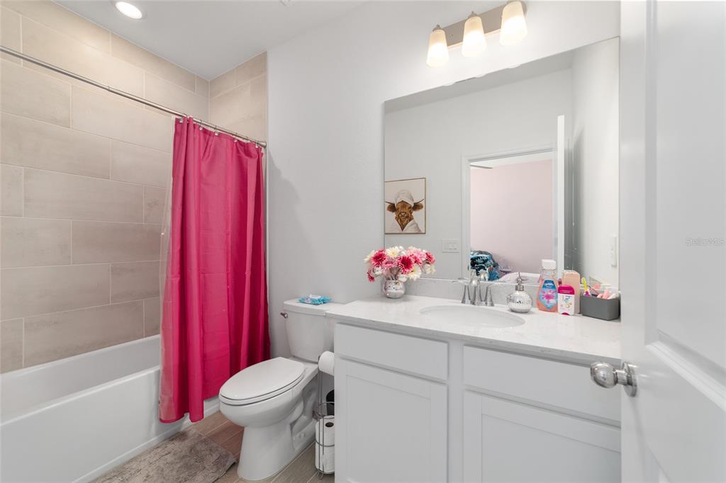 4012 Northeast 33rd Avenue Ocala, FL 34479 - Photo 43 of 77 a bathroom with a sink toilet vanity and tub