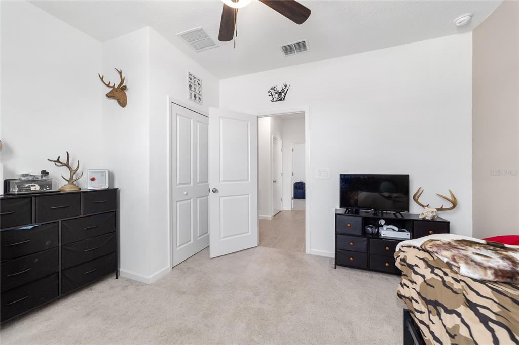 4012 Northeast 33rd Avenue Ocala, FL 34479 - Photo 45 of 77 a living room with furniture and a flat screen tv