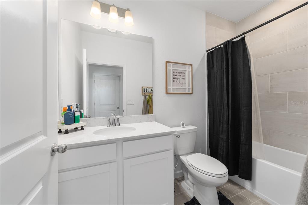 4012 Northeast 33rd Avenue Ocala, FL 34479 - Photo 47 of 77 a bathroom with a sink toilet and shower