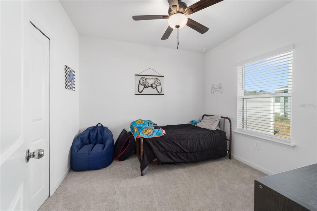 4012 Northeast 33rd Avenue Ocala, FL 34479 - Photo 48 of 77 a living room with a bed and a window