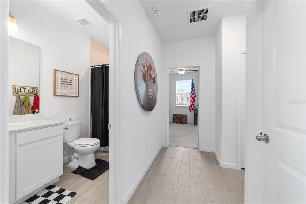 4012 Northeast 33rd Avenue Ocala, FL 34479 - Photo 49 of 77 a bathroom with a toilet sink and mirror