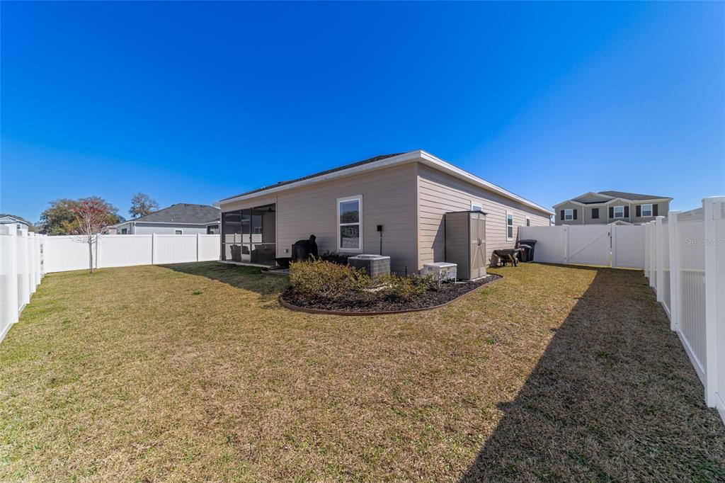4012 Northeast 33rd Avenue Ocala, FL 34479 - Photo 59 of 77 a view of a house with backyard and trees
