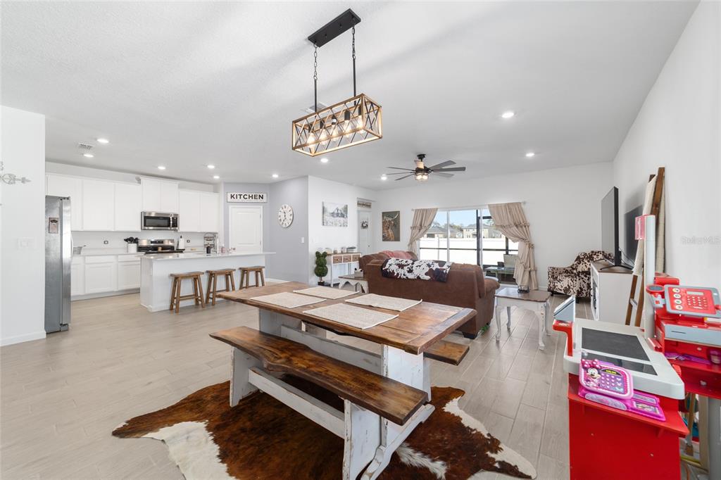 4012 Northeast 33rd Avenue Ocala, FL 34479 - Photo 8 of 77 a large kitchen with a table and chairs
