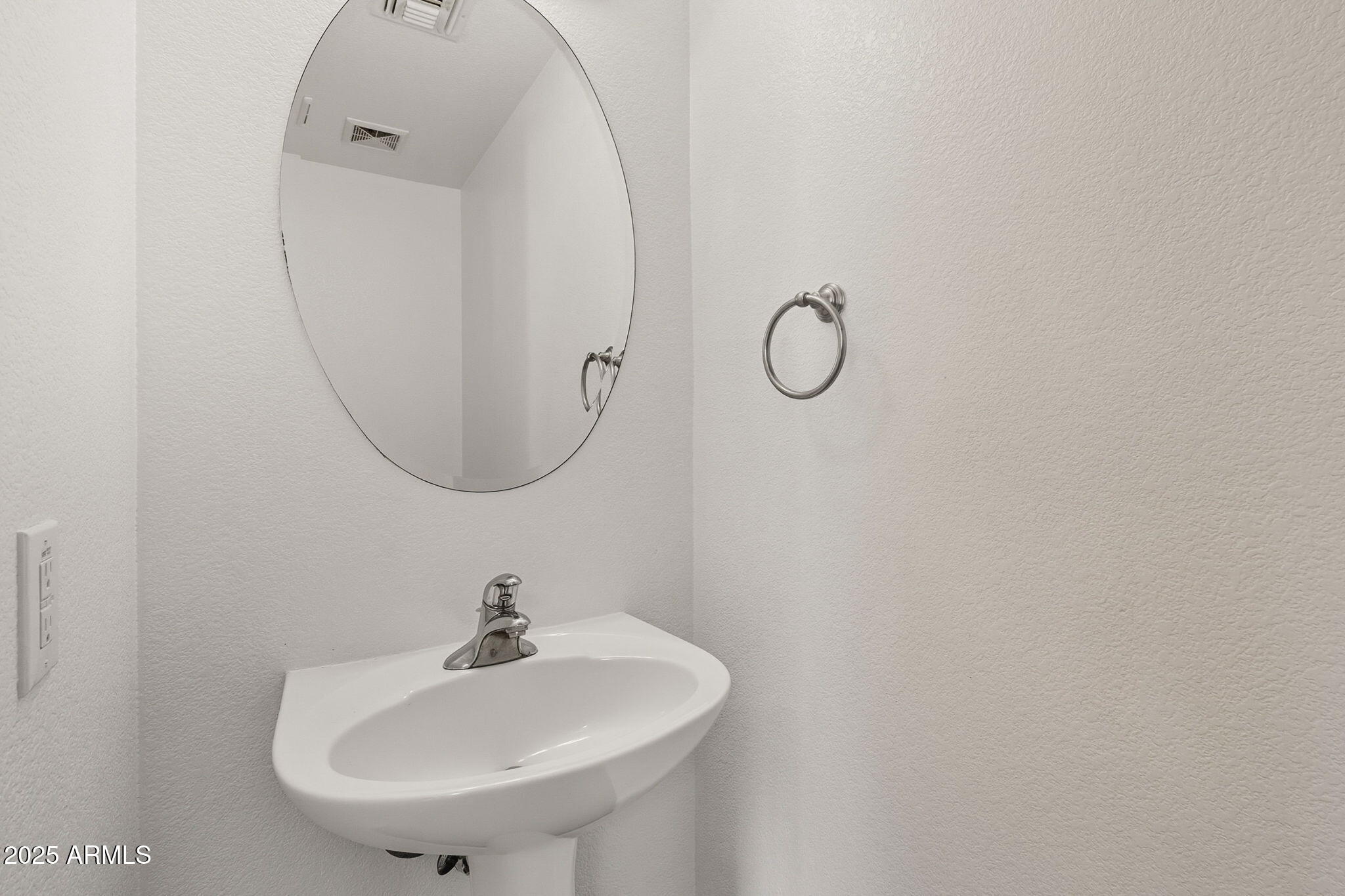 2503 West Gambit Trail Phoenix, AZ 85085 - Photo 26 of 54 a bathroom with a sink and mirror