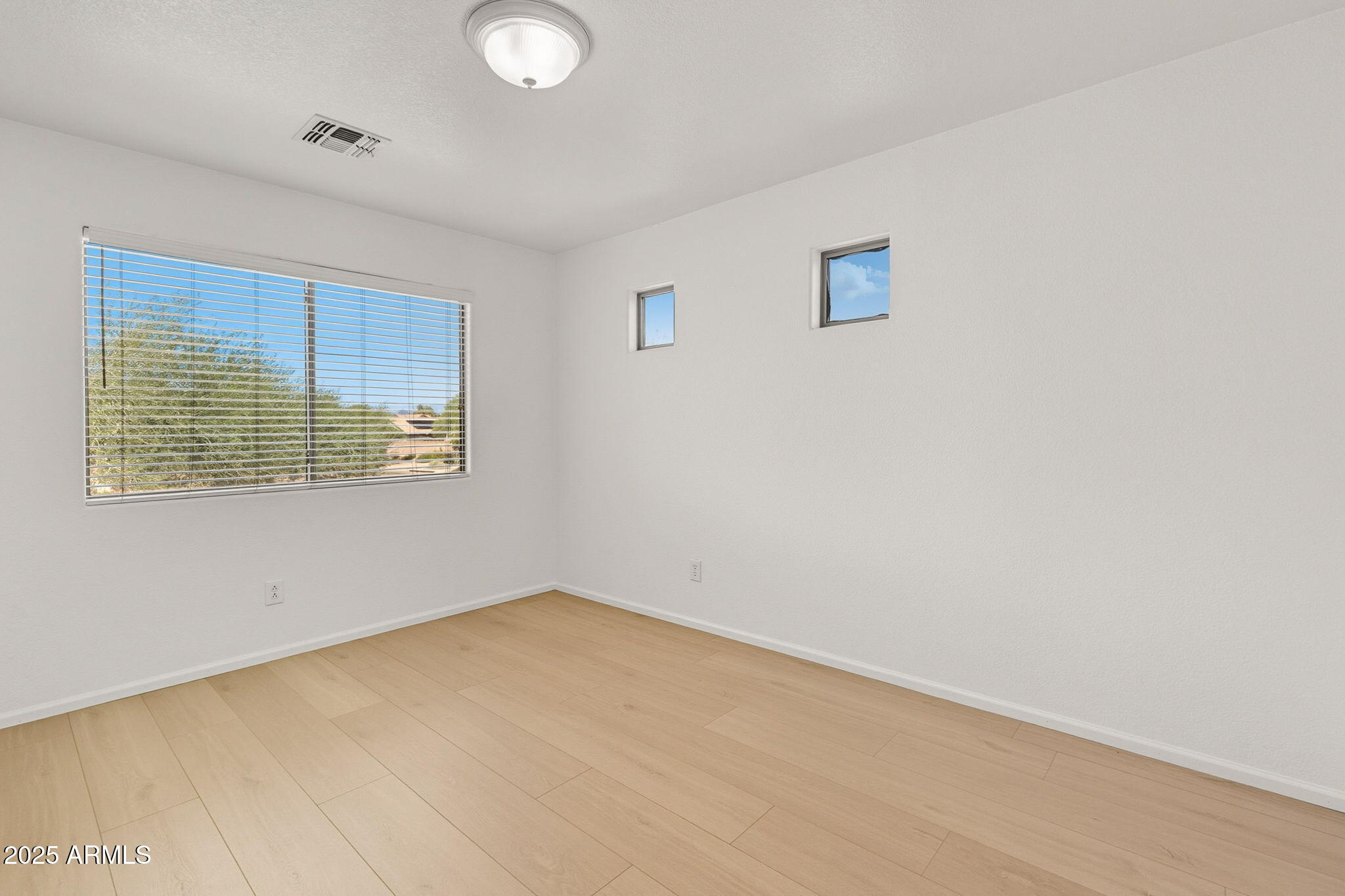 2503 West Gambit Trail Phoenix, AZ 85085 - Photo 27 of 54 an empty room with windows