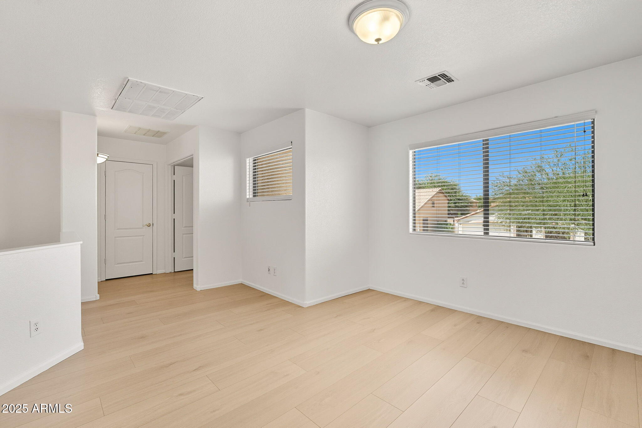 2503 West Gambit Trail Phoenix, AZ 85085 - Photo 28 of 54 a view of an empty room with a window