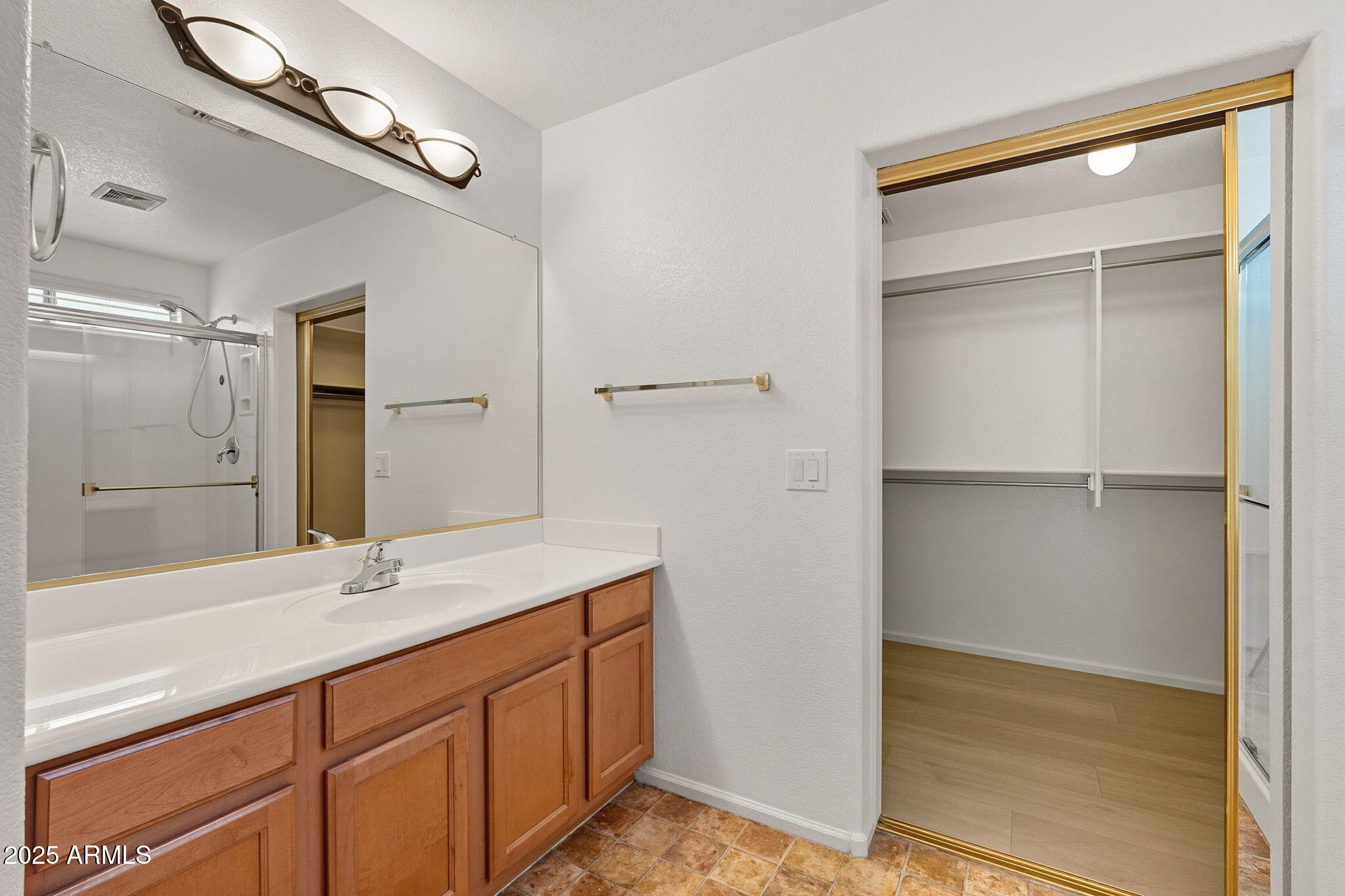 2503 West Gambit Trail Phoenix, AZ 85085 - Photo 34 of 54 a bathroom with a shower sink and mirror