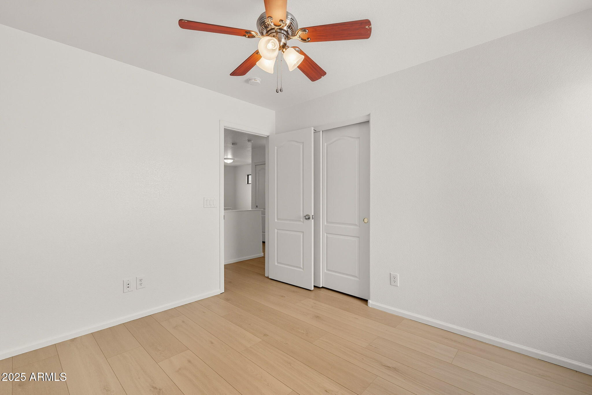 2503 West Gambit Trail Phoenix, AZ 85085 - Photo 42 of 54 wooden floor in an empty room