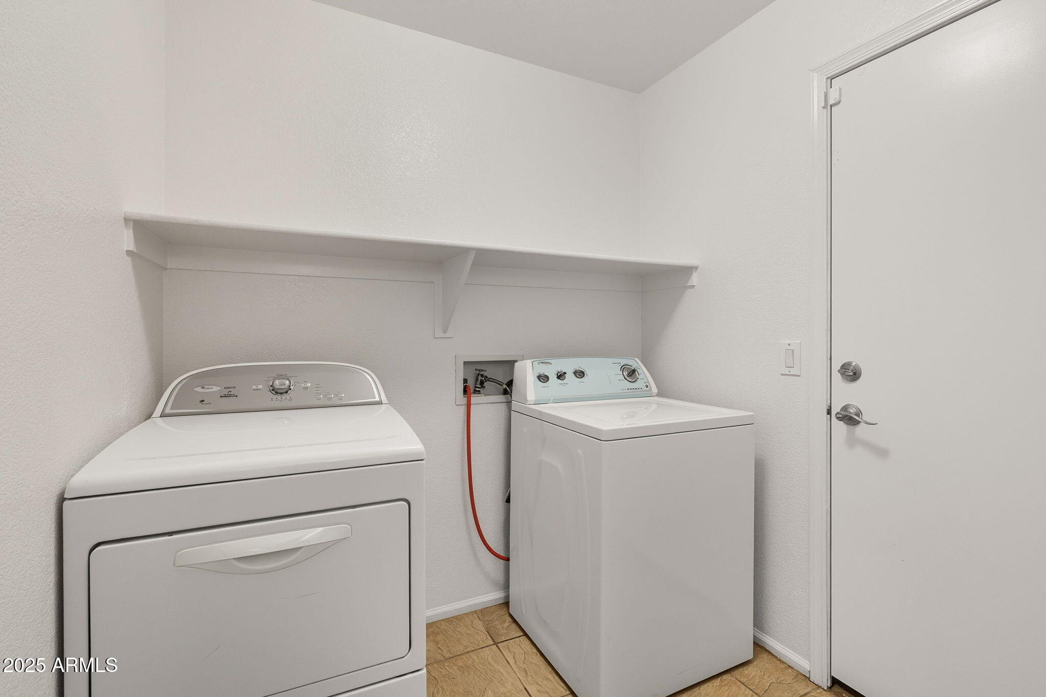 2503 West Gambit Trail Phoenix, AZ 85085 - Photo 45 of 54 a utility room with dryer and washer