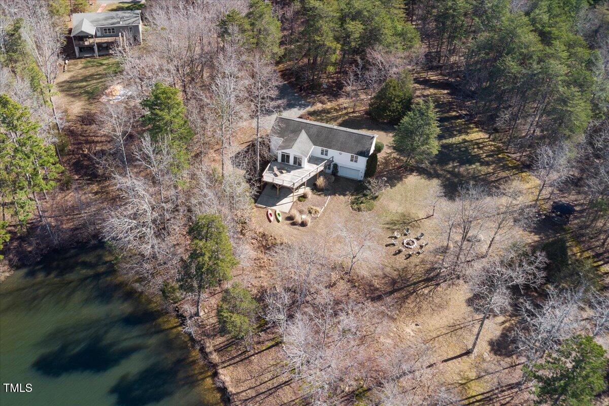 1171 Buck Street Road Roxboro, NC 27574 - Photo 1 of 63 a view of a lake with houses