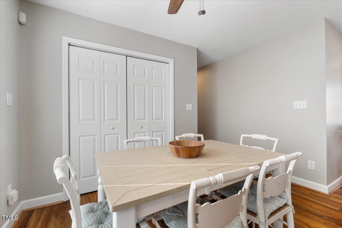 1171 Buck Street Road Roxboro, NC 27574 - Photo 17 of 63 a view of a dining room with furniture and wooden floor