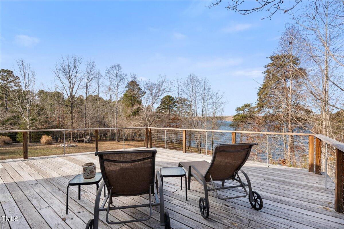 1171 Buck Street Road Roxboro, NC 27574 - Photo 21 of 63 a view of a chairs and table on the deck