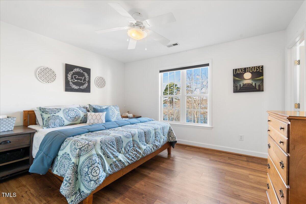 1171 Buck Street Road Roxboro, NC 27574 - Photo 23 of 63 a bedroom with a bed and a window
