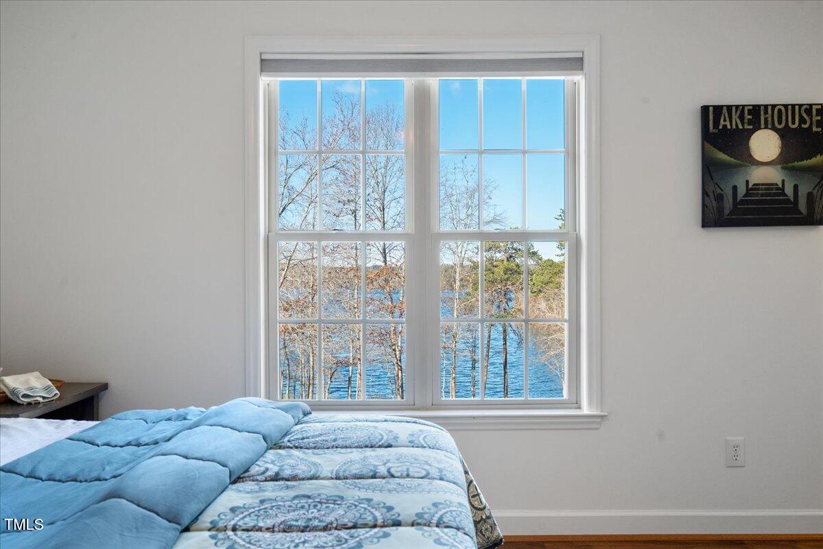 1171 Buck Street Road Roxboro, NC 27574 - Photo 24 of 63 a bedroom with furniture and a window
