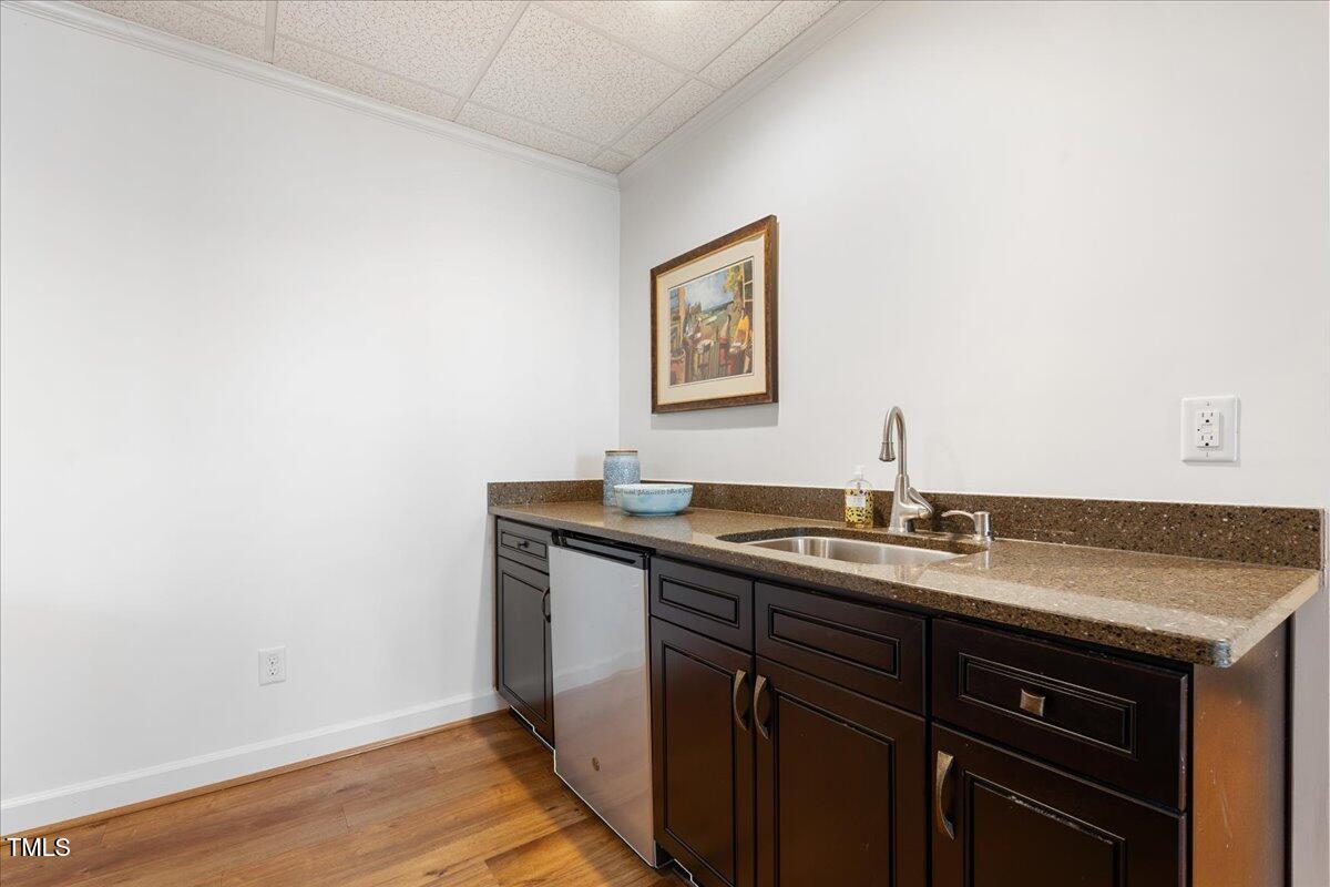1171 Buck Street Road Roxboro, NC 27574 - Photo 28 of 63 a kitchen with a sink and cabinets