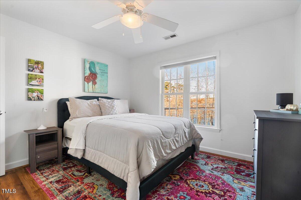 1171 Buck Street Road Roxboro, NC 27574 - Photo 32 of 63 a bedroom with a bed and a window
