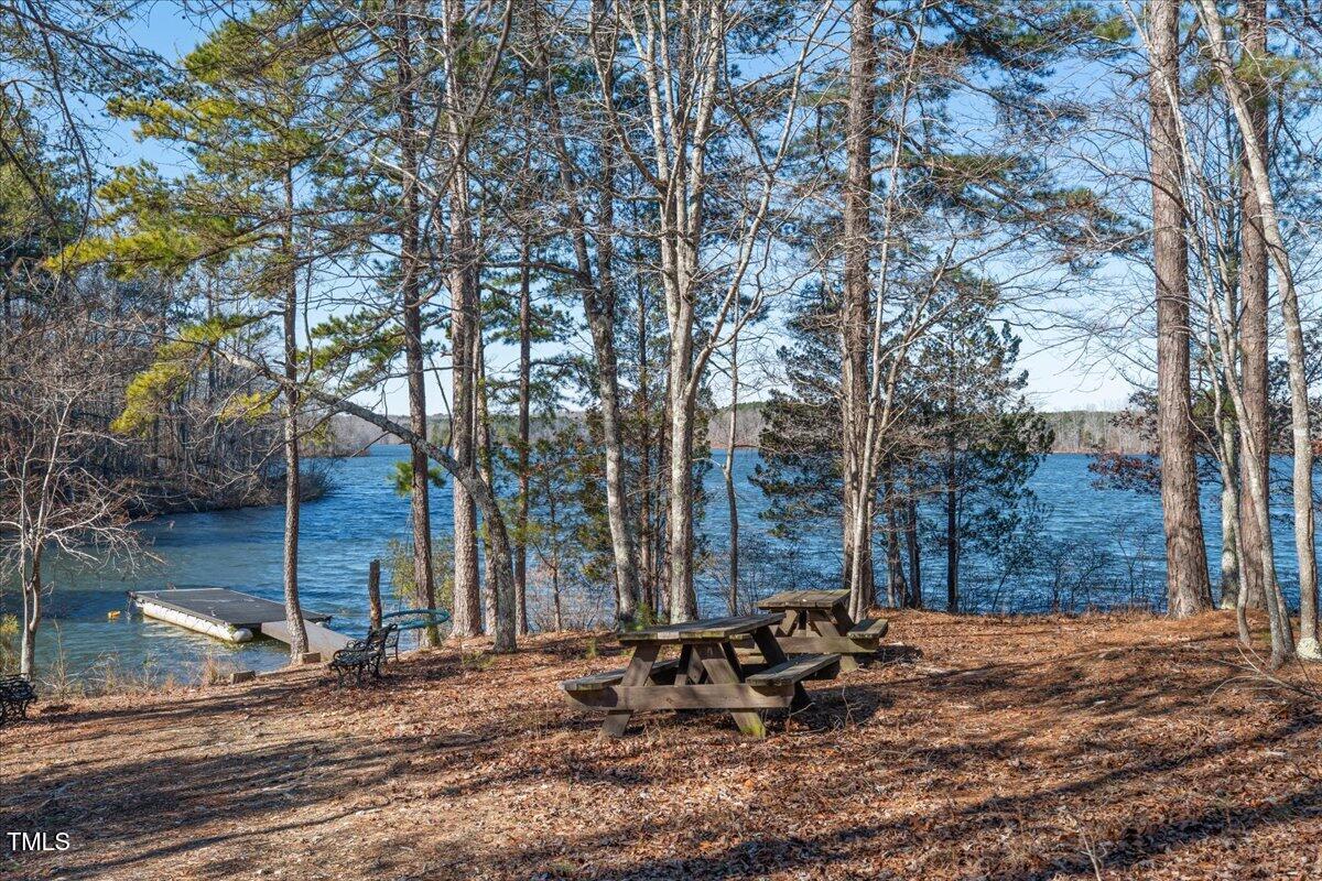 1171 Buck Street Road Roxboro, NC 27574 - Photo 39 of 63 a backyard of a house with outdoor seating