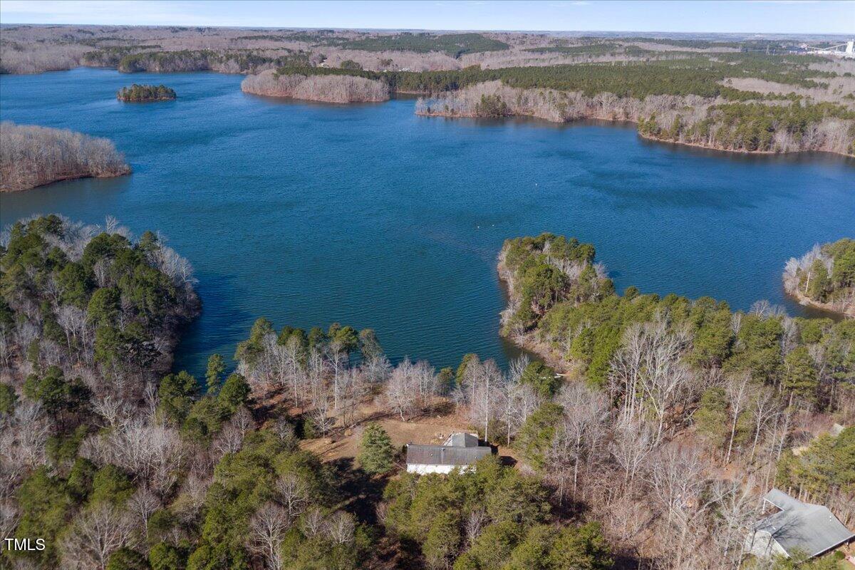 1171 Buck Street Road Roxboro, NC 27574 - Photo 47 of 63 a view of a lake with a mountain