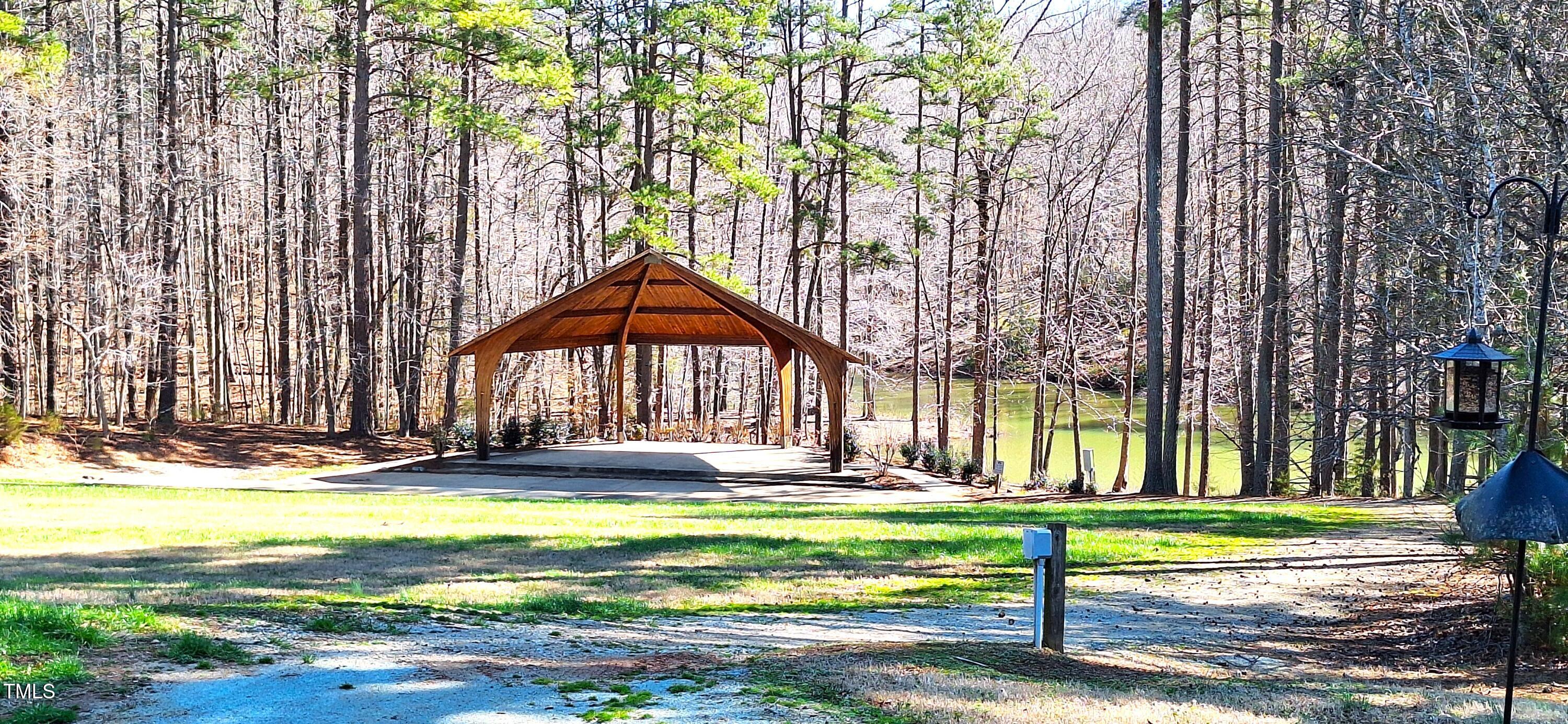 1171 Buck Street Road Roxboro, NC 27574 - Photo 55 of 63 a view of swimming pool with large trees and wooden fence