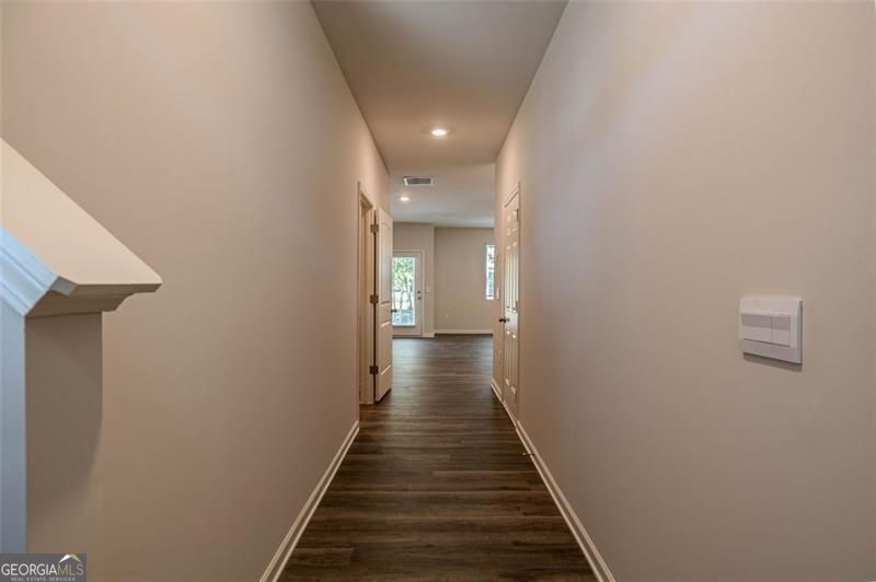 1005 North 2nd Avenue Northwest, Unit 31 Rome, GA 30165 - Photo 20 of 20 a view of a hallway with wooden floor and staircase