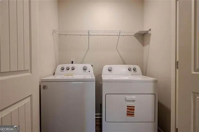 a utility room with dryer and washer