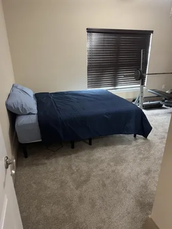 a room with a bed and a chair