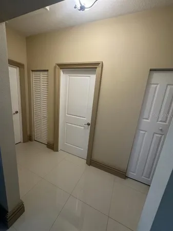 a bedroom with a bed and a mirror