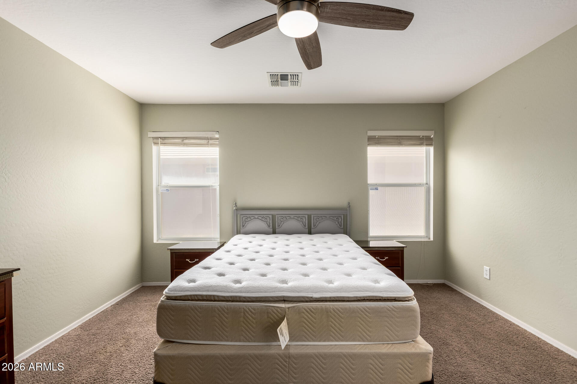 1491 East Rolls Road San Tan Valley, AZ 85143 - Photo 15 of 35 a bedroom with a bed and a window