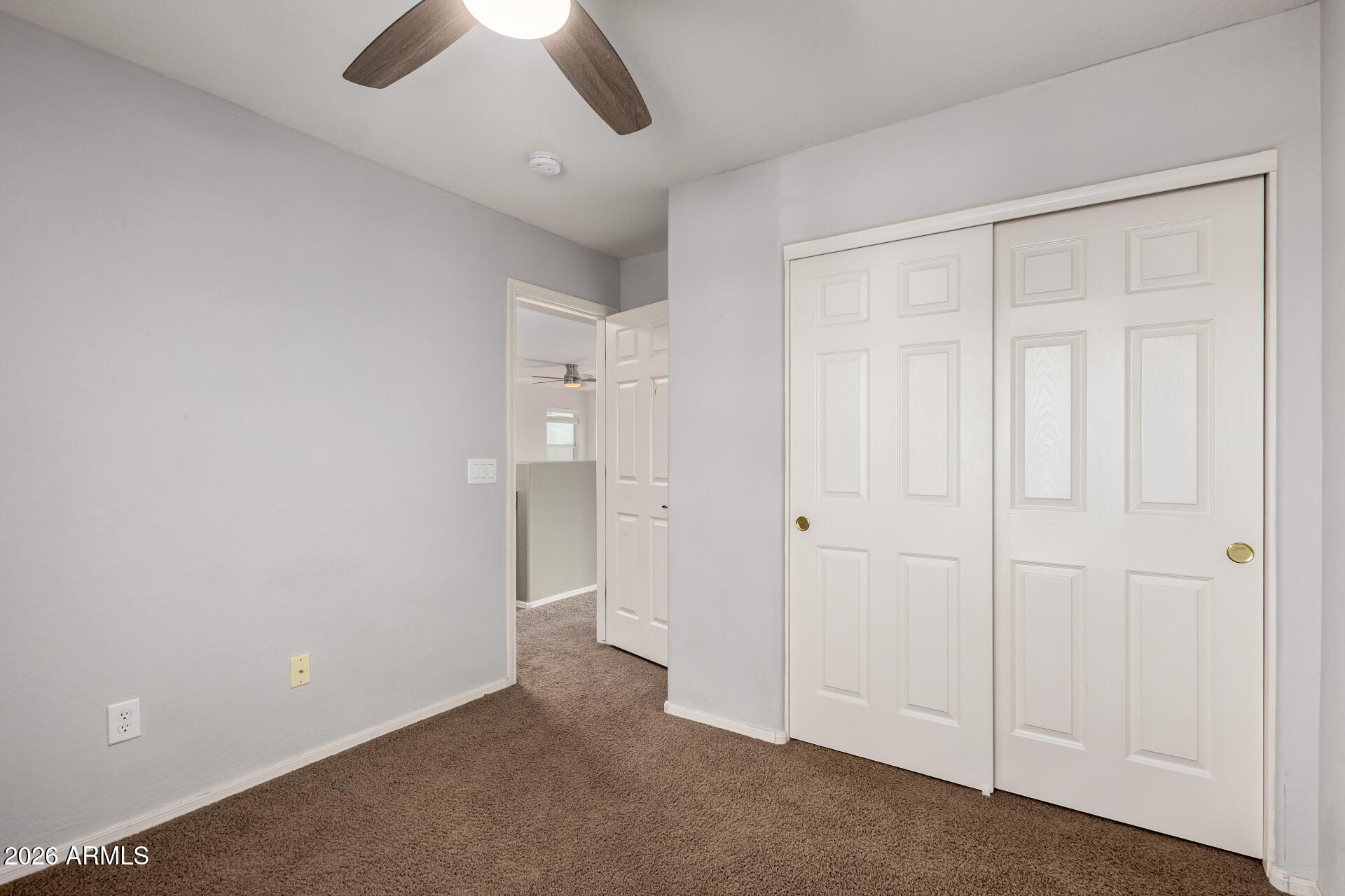 1491 East Rolls Road San Tan Valley, AZ 85143 - Photo 21 of 35 wooden floor in an empty room