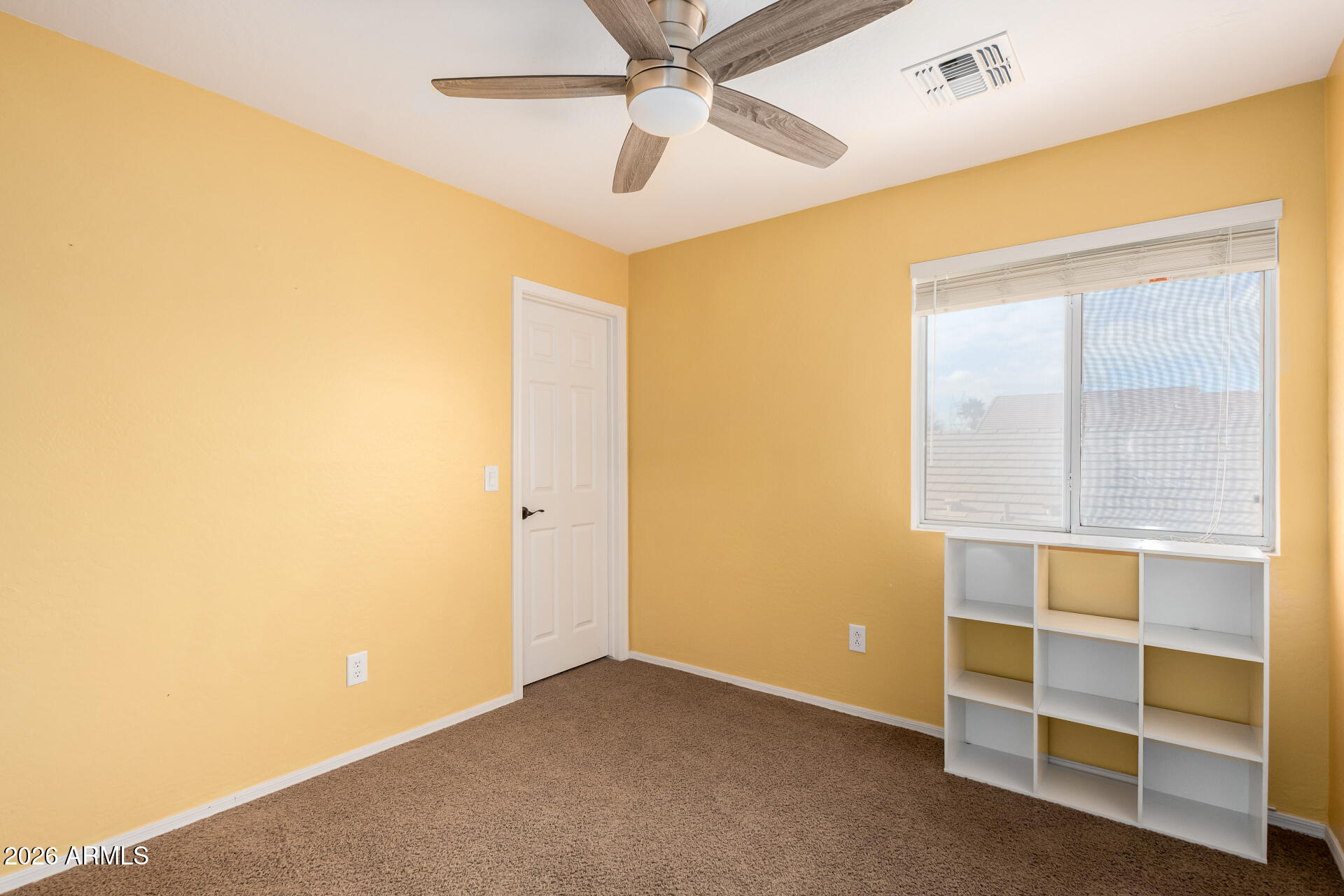 1491 East Rolls Road San Tan Valley, AZ 85143 - Photo 22 of 35 a view of room with ceiling fan and window