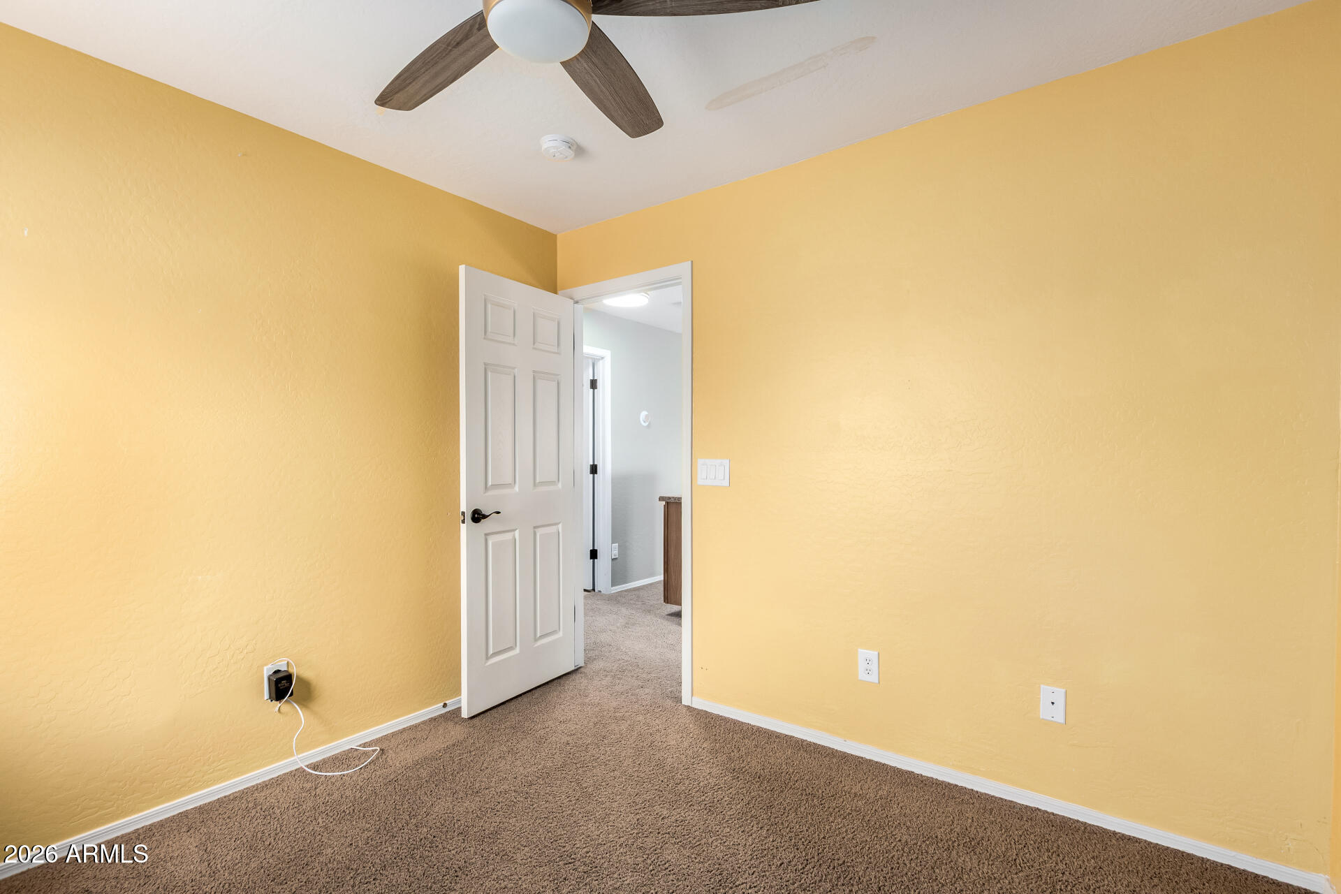 1491 East Rolls Road San Tan Valley, AZ 85143 - Photo 23 of 35 a view of a big room with a ceiling fan and a bathroom