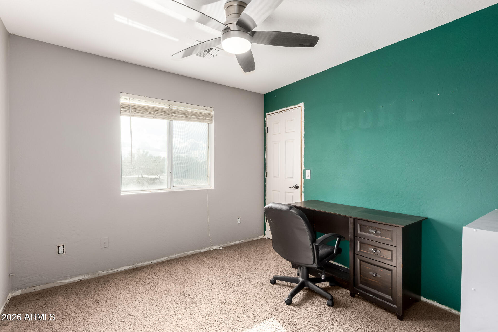 1491 East Rolls Road San Tan Valley, AZ 85143 - Photo 24 of 35 a view of a workspace with furniture and a window