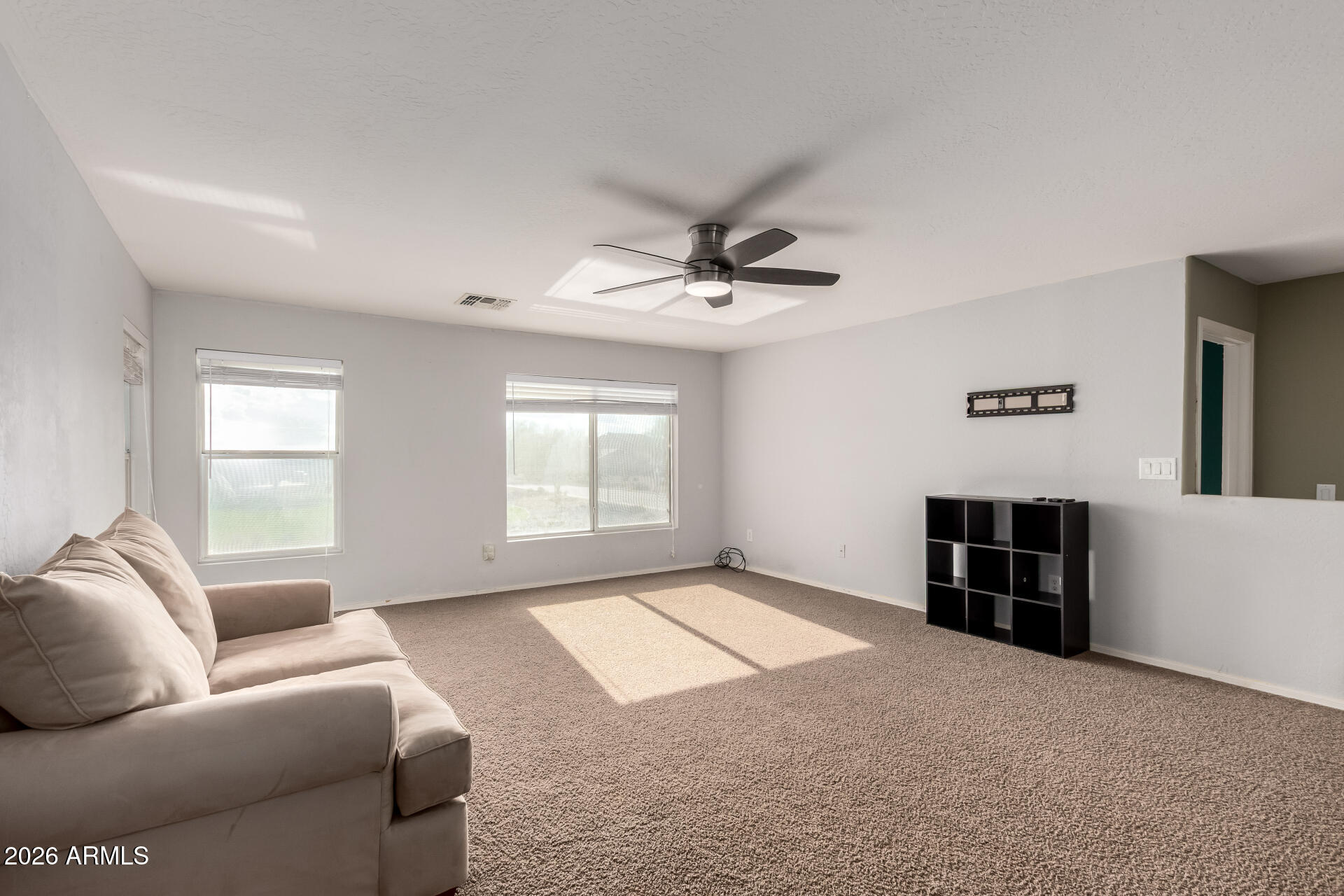 1491 East Rolls Road San Tan Valley, AZ 85143 - Photo 28 of 35 a living room with furniture and a window