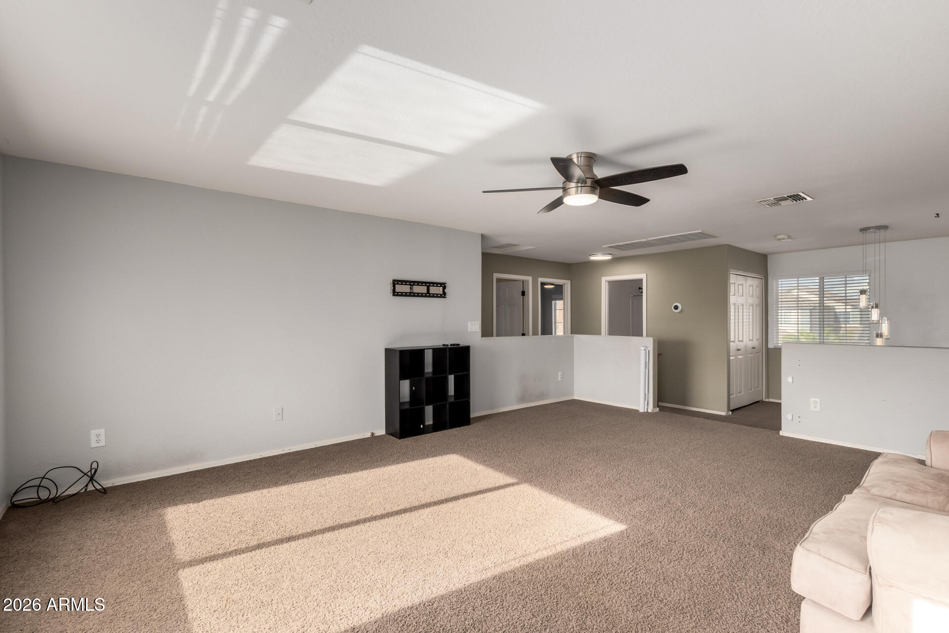 1491 East Rolls Road San Tan Valley, AZ 85143 - Photo 29 of 35 a living room with furniture and a ceiling fan