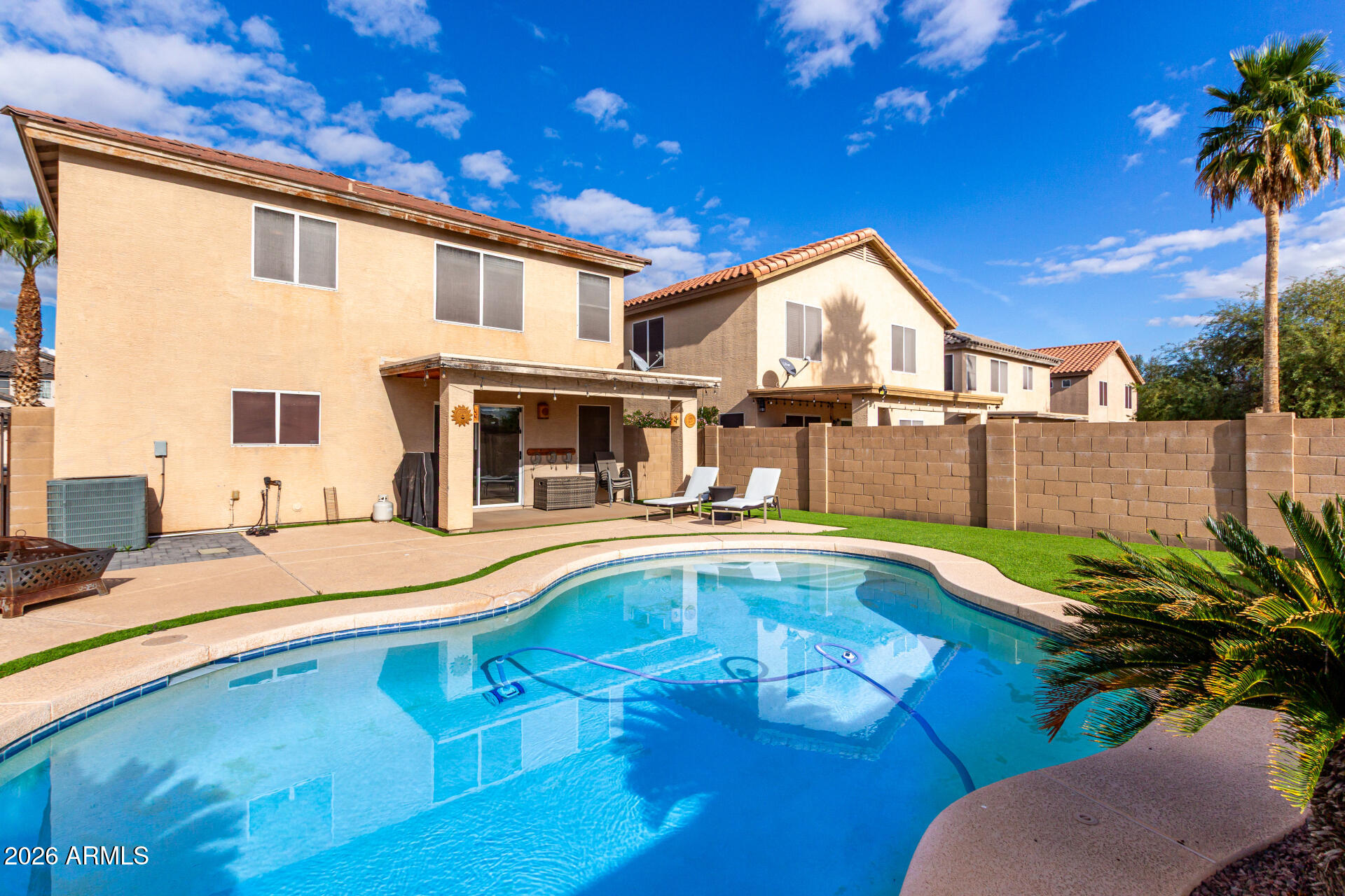 1491 East Rolls Road San Tan Valley, AZ 85143 - Photo 32 of 35 a swimming pool with outdoor seating and yard