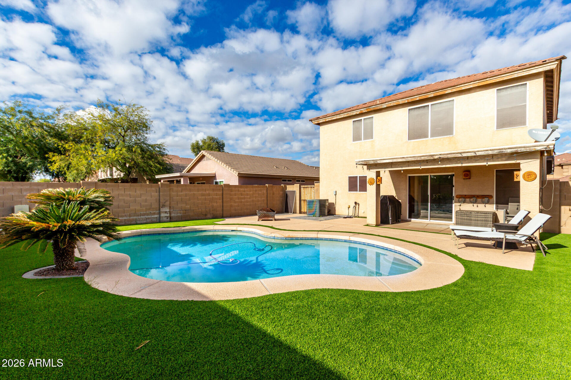 1491 East Rolls Road San Tan Valley, AZ 85143 - Photo 34 of 35 a swimming pool with outdoor seating and yard