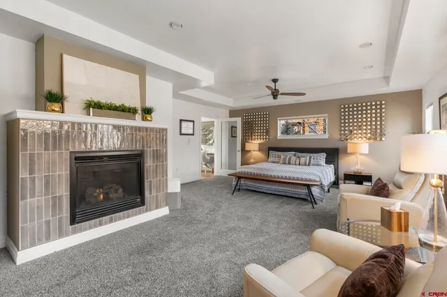 a bedroom with furniture and a fireplace