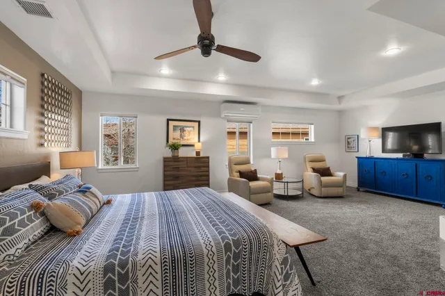 a bedroom with a bed and furniture