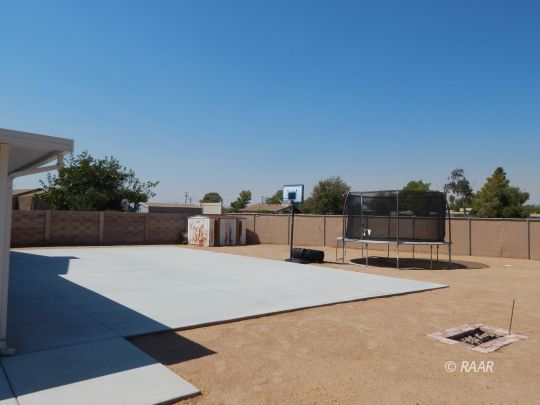 517 Suzanne Street Ridgecrest, CA 93555 - Photo 29 of 34 a terrace with a bench