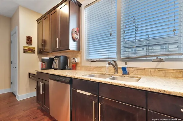 a kitchen with a sink and cabinets