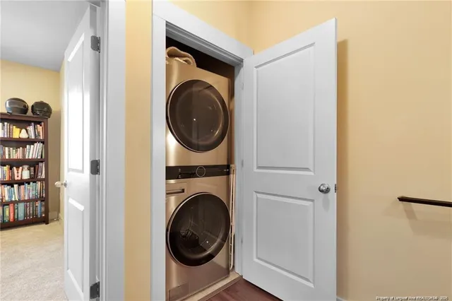 a view of a hallway with washer and dryer