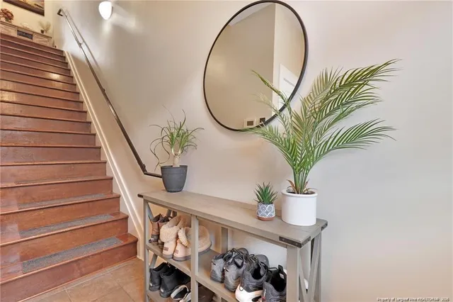 a vase of flowers sitting on a floor