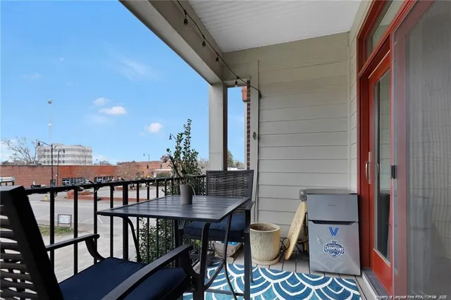 a view of balcony with furniture