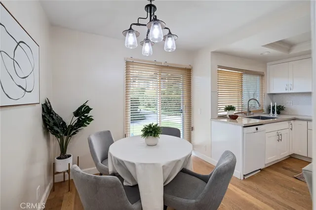 a kitchen with stainless steel appliances a stove a sink and a refrigerator
