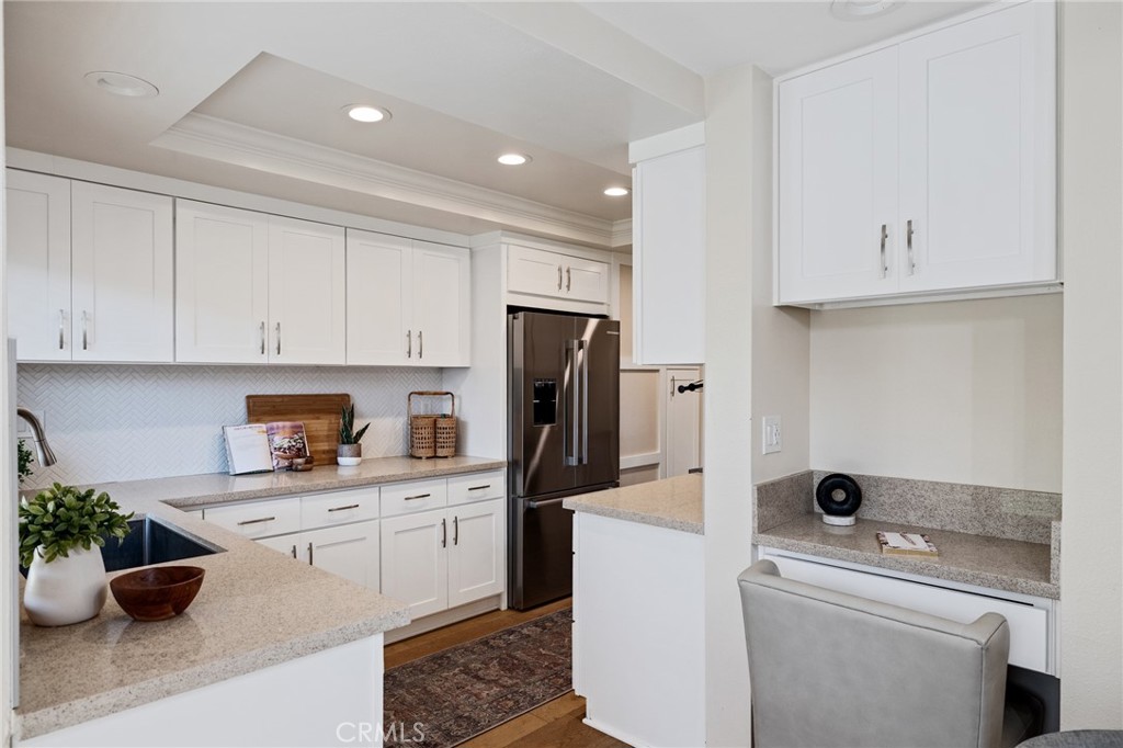 58 Hilltop Circle Rancho Palos Verdes, CA 90275 - Photo 16 of 51 a view of a kitchen with a sink and dishwasher a refrigerator with white cabinets