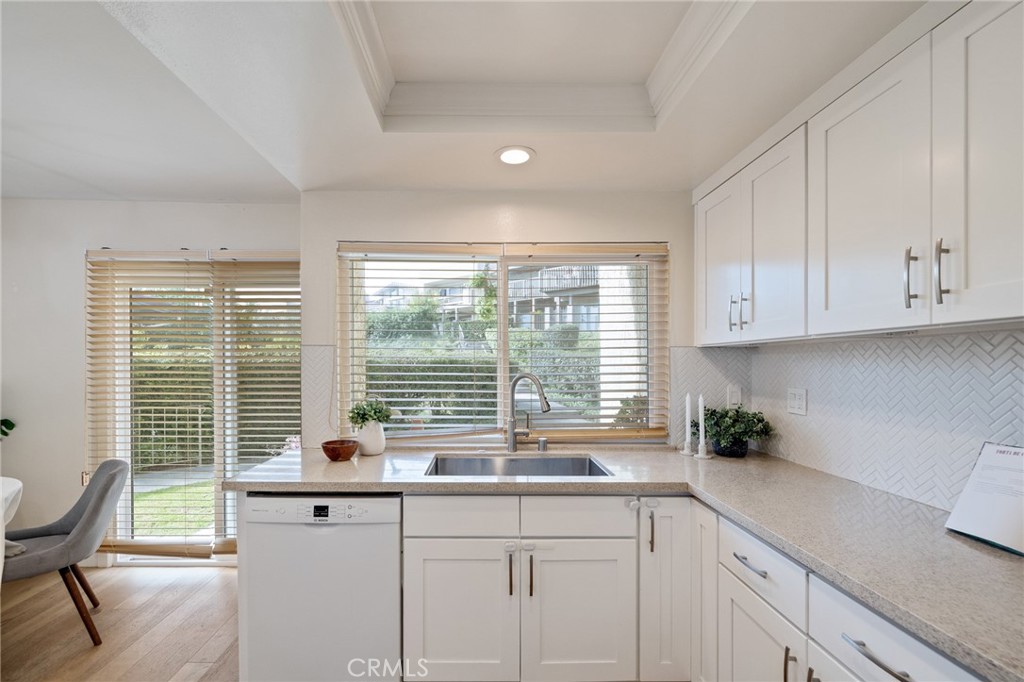 58 Hilltop Circle Rancho Palos Verdes, CA 90275 - Photo 18 of 51 a kitchen with granite countertop white cabinets and a large window